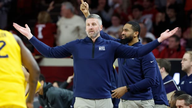 Jan 17, 2024; Norman, Oklahoma, USA; West Virginia Mountaineers head coach Josh Eilert gestures during a play against the Oklahoma Sooners in the first half at Lloyd Noble Center. Mandatory Credit: Alonzo Adams-USA TODAY Sports  